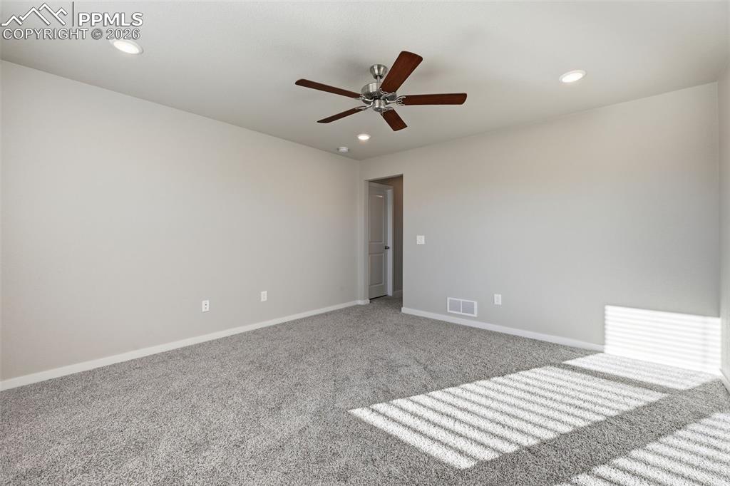 Image 26 of 48: Empty room with carpet floors, recessed lighting, and a ceiling fan