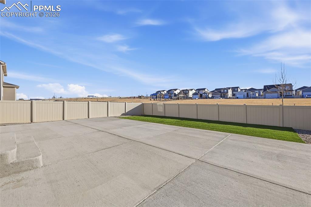 Image 45 of 48: View of patio with a residential view