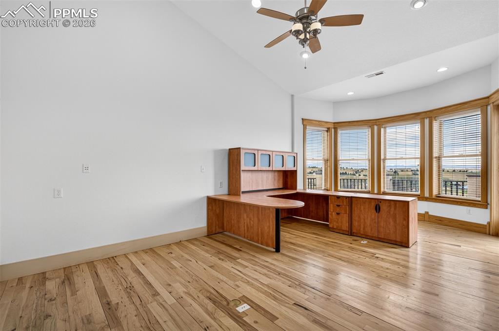 Image 14 of 50: Large office with built ins and incredible views