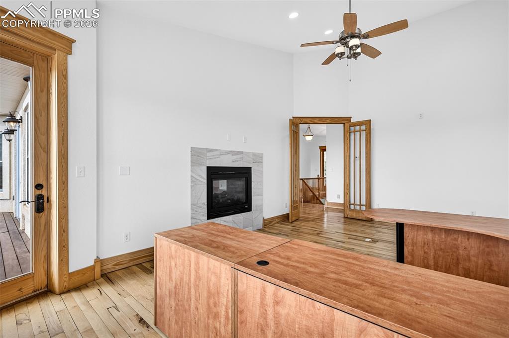 Image 16 of 50: Office with 2 sided fireplace 