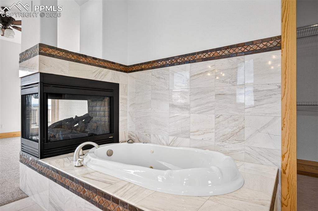 Image 22 of 50: Jetted tub in primary bath