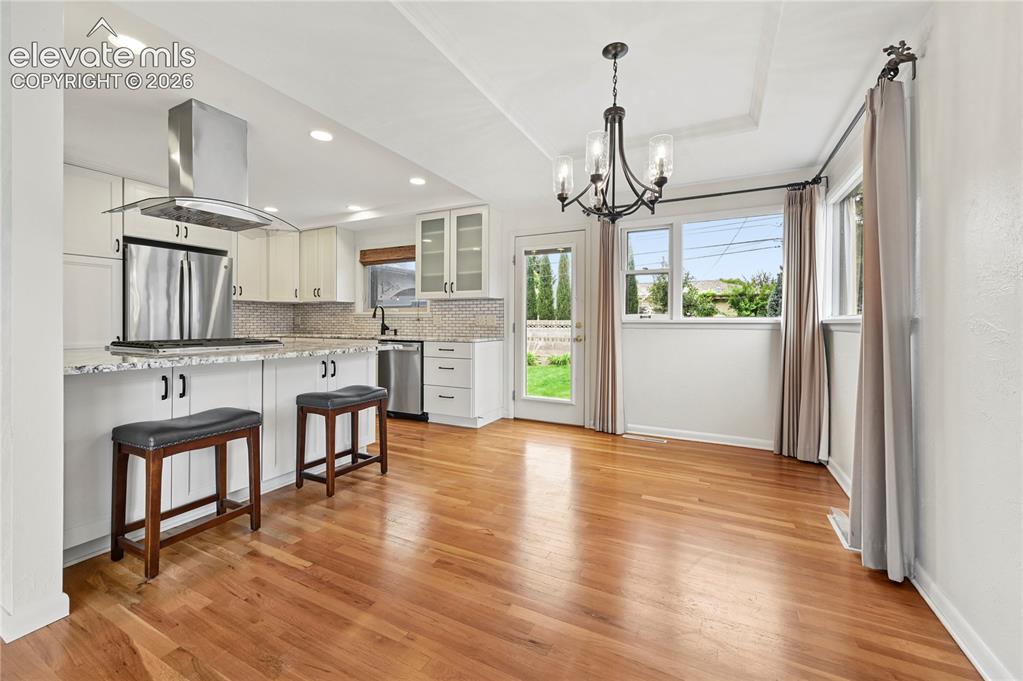 Image 12 of 50: Dining Room (Looking Towards Backyard from Living Room)