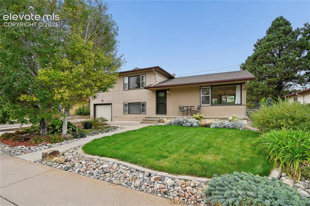 Image 2 of 50: Beautifully Landscaped Front Yard
