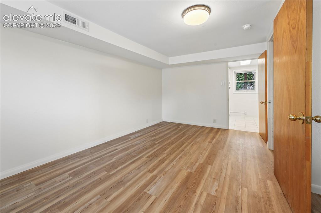 Image 30 of 50: Lower Level Family Room (Looking Towards Laundry)