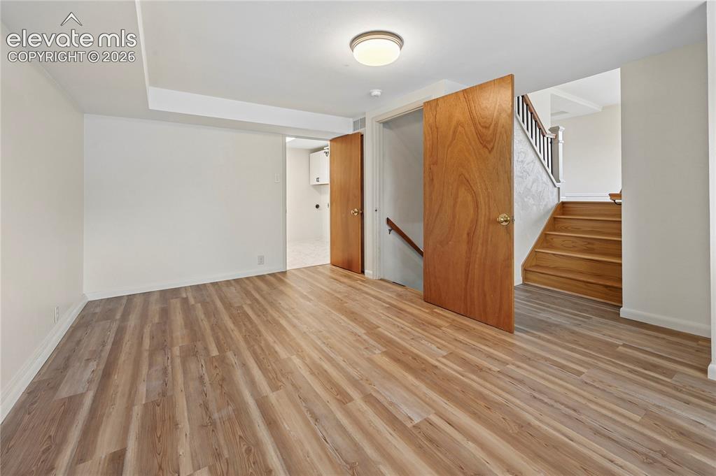Image 31 of 50: Lower Level Family Room (Looking Towards Stairs & Laundry)