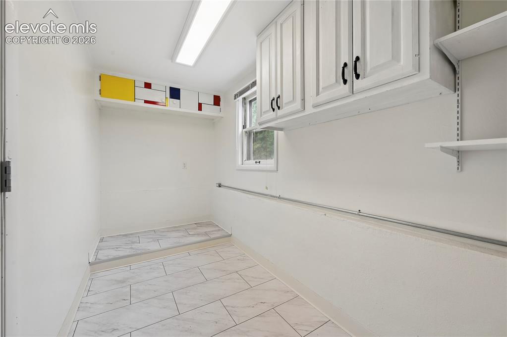 Image 35 of 50: HUGE, Expanded Laundry with LOTS of Storage!!