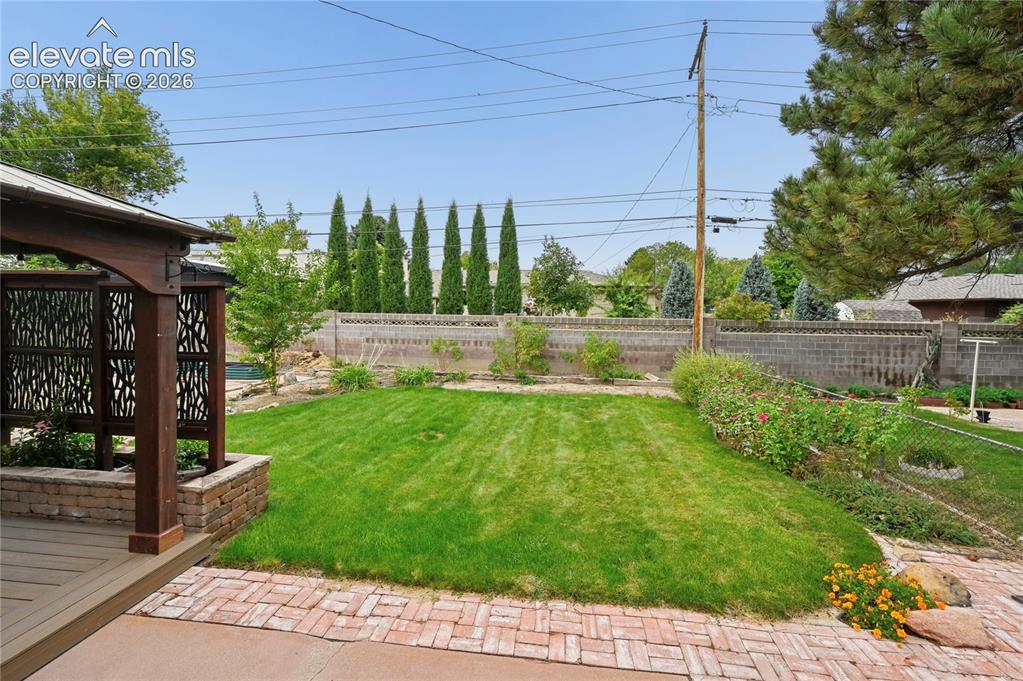 Image 43 of 50: Beautifully Landscaped Backyard