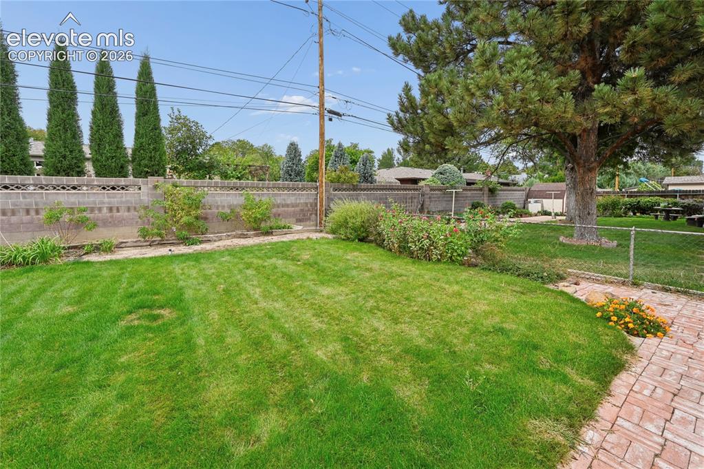 Image 44 of 50: Beautifully Landscaped Backyard
