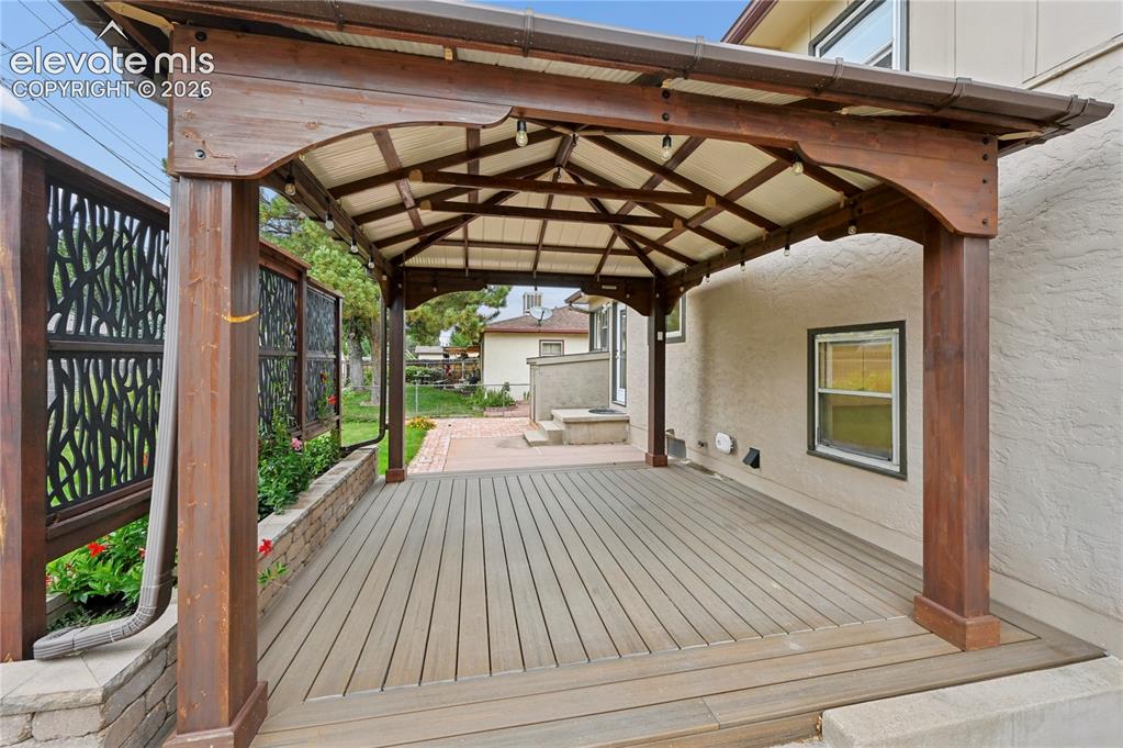Image 47 of 50: Covered Deck in Backyard