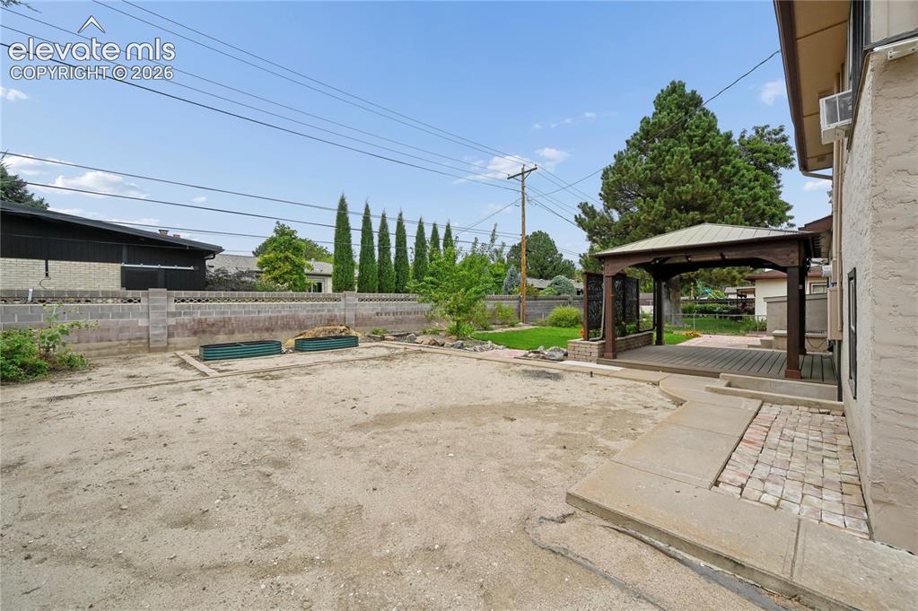 Image 48 of 50: Backyard with Space for Parking or Your Next Project!