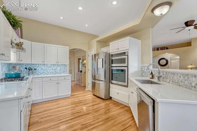 Image 15 of 48: Kitchen with stainless steel appliances