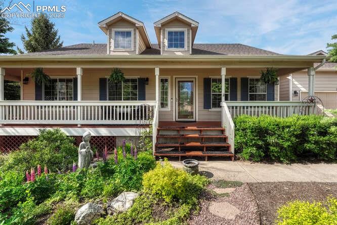 Image 2 of 48: View of front of house featuring a covered porch