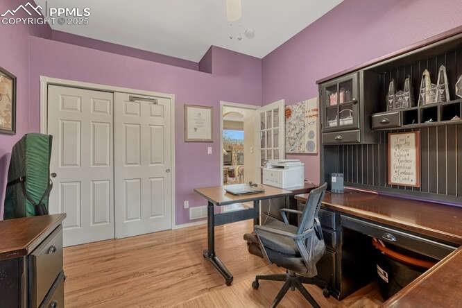 Image 23 of 48: Main level bedroom currently used as an office