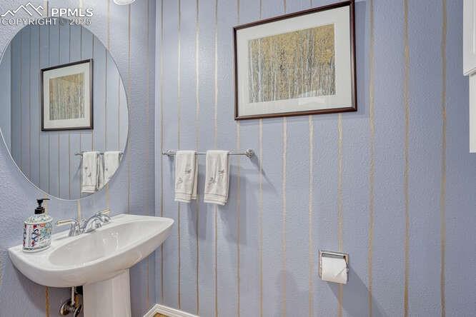 Image 24 of 48: Main level half bathroom