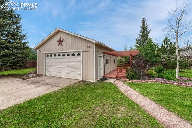 Image 40 of 48: Garage/workshop featuring a heater