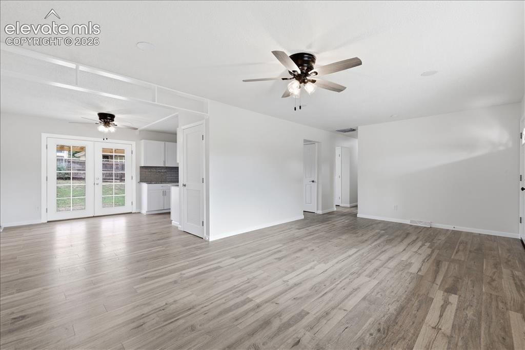 Image 10 of 44: Very open with French doors to the backyard.