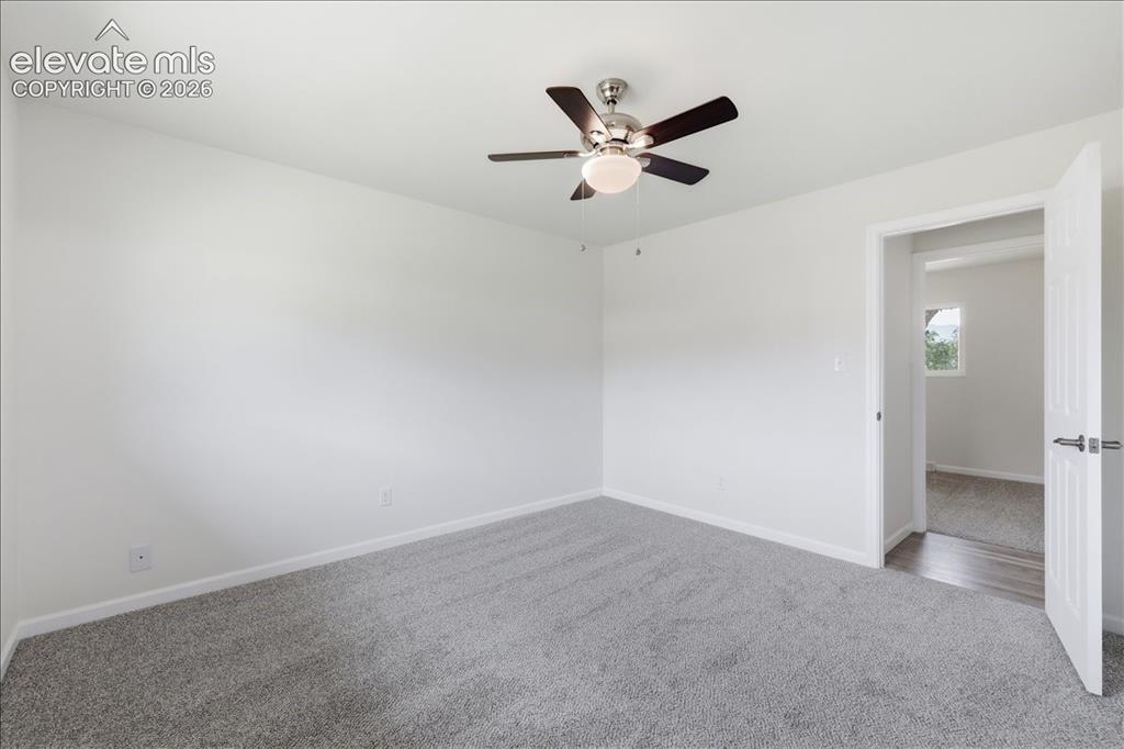 Image 14 of 44: Main level primary bedroom.