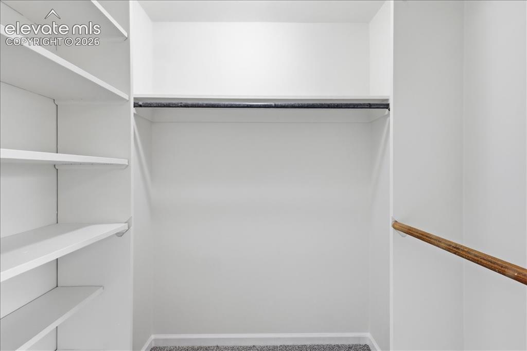 Image 16 of 44: Large walk-in closet.