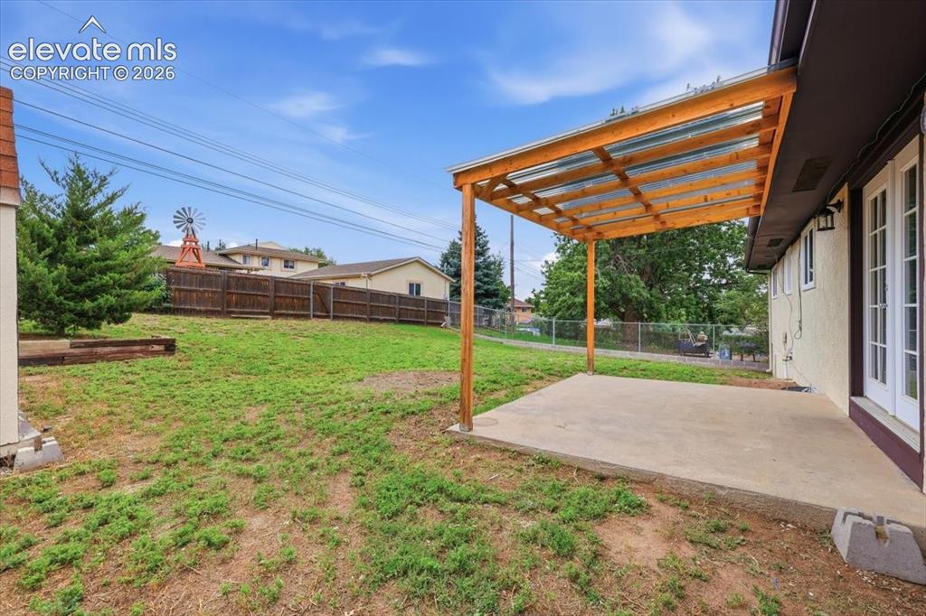Image 42 of 44: Covered back porch.