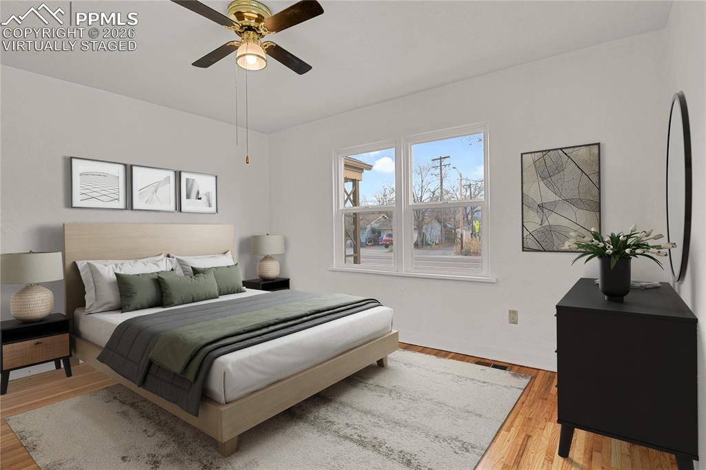 Image 12 of 29: Generously sized bedroom. Virtually Staged