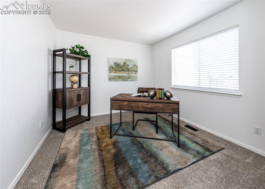 Image 22 of 50: Home office featuring carpet and baseboards
