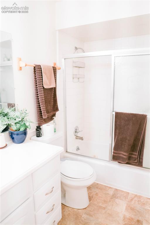 Image 14 of 23: White vanity with cabinet storage and drawer pulls