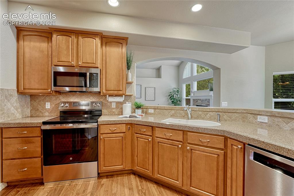 Image 20 of 42: Note the arched entries throughout the home.