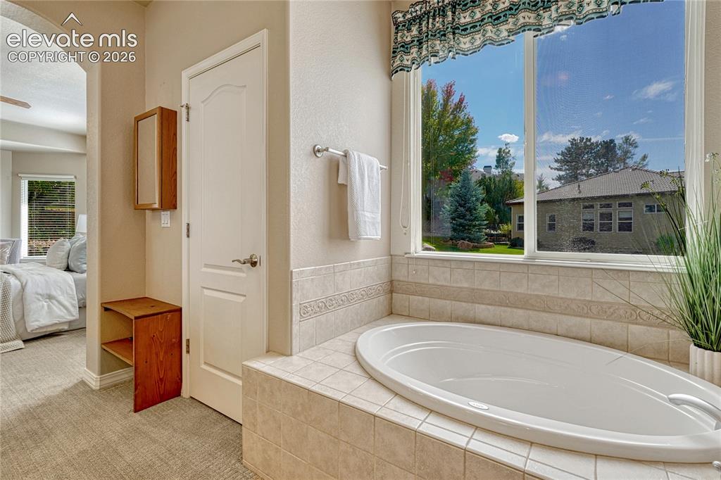 Image 26 of 42: Soaker tub in the primary bath.