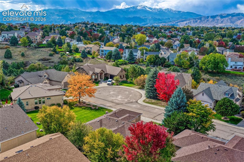 Image 3 of 42: Pikes Peak view, hardwood floors, central air conditioning and main level l