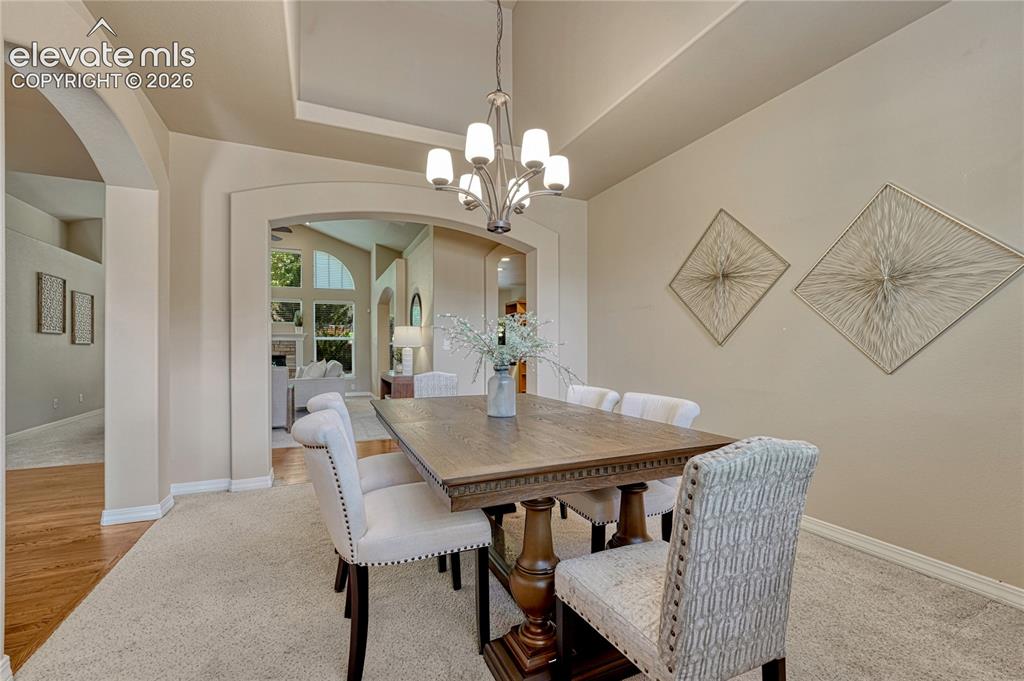 Image 5 of 42: Enter to hardwood floors and the formal dining room adjacent to foyer.
