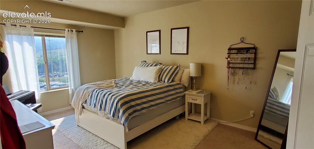 Image 8 of 20: Recessed window, neutral wall color, and light-toned carpeting