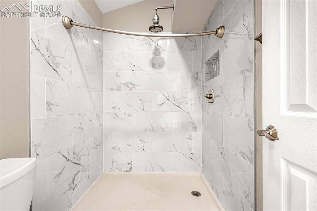 Image 21 of 28: Bathroom with a stall shower