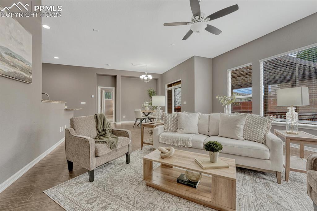 Image 15 of 50: White cabinetry with roll-out shelving and beautiful granite countertops an