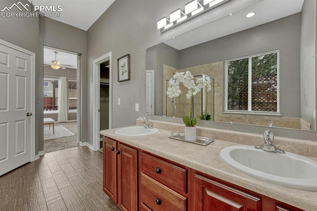 Image 20 of 50: The Primary Bedroom provides a private retreat with neutral carpet, a light