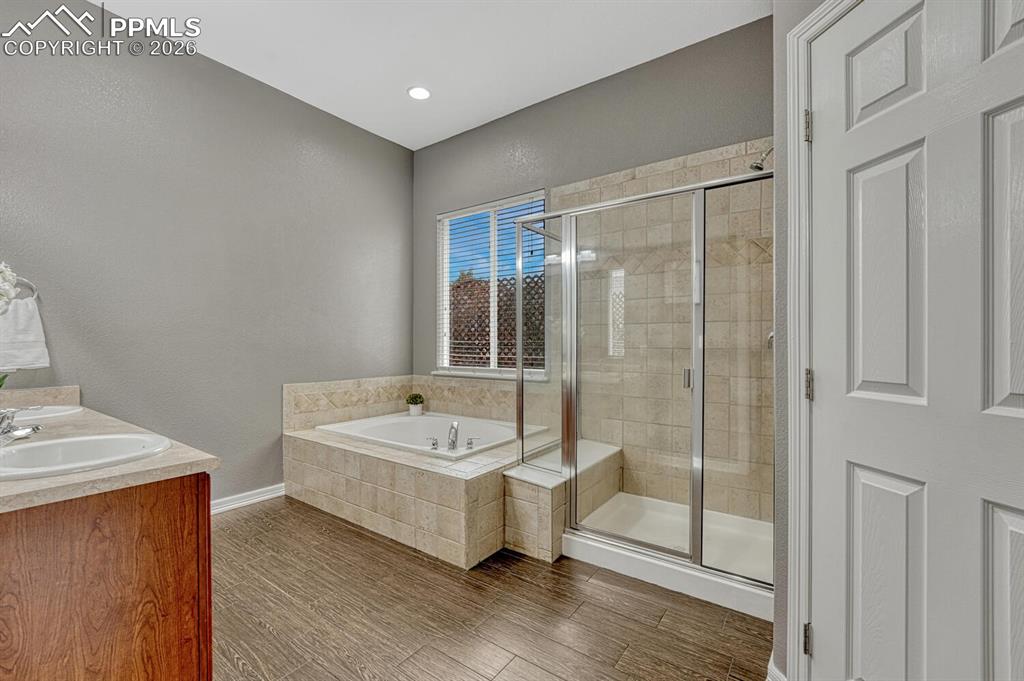 Image 21 of 50: Primary Bedroom with barn door that leads into the luxurious 5-piece Primar