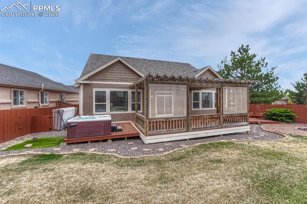Image 42 of 50: Basement Bathroom with dual sink vanity, mirror, and tiled tub/shower.