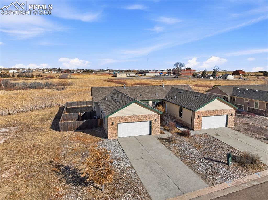 Image 36 of 41: View of front of house featuring driveway and an attached garage