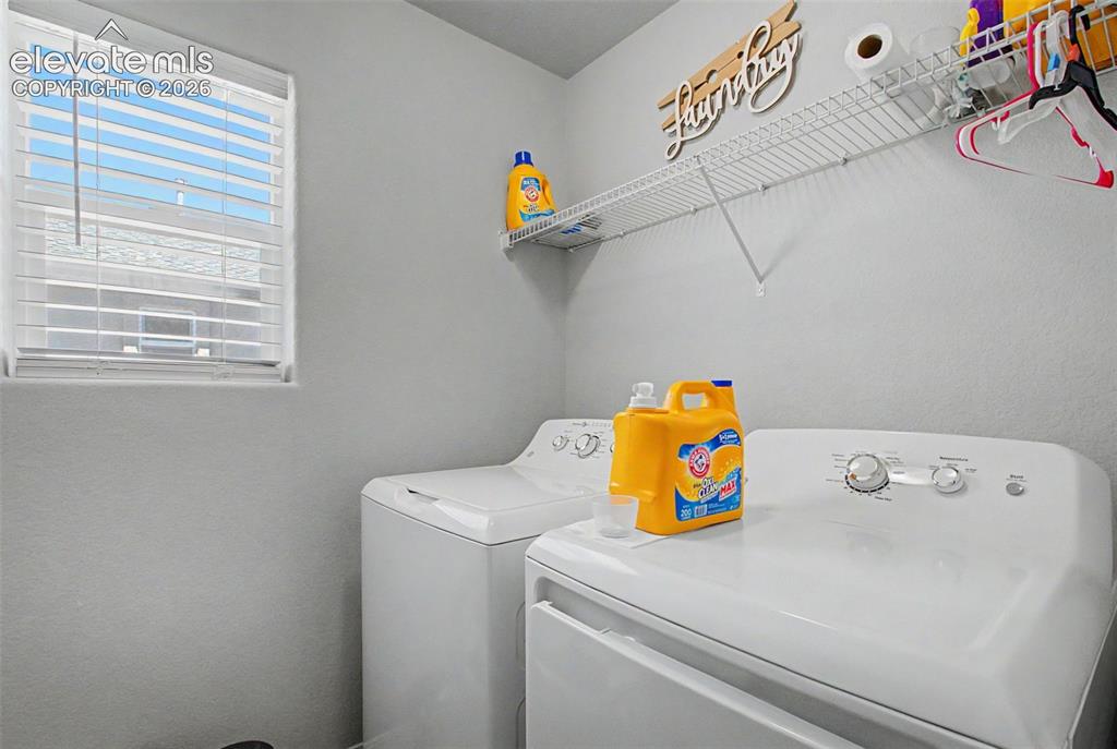 Image 17 of 34: Laundry room on upper level for convenience