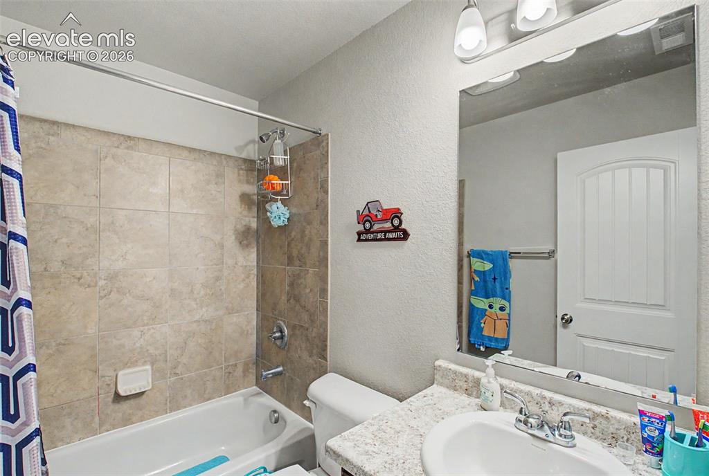 Image 26 of 34: Second full bathroom on upper level