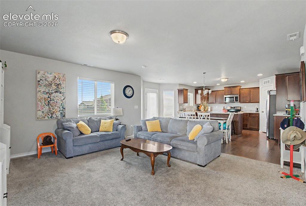 Image 5 of 34: Open concept living room, dining, and kitchen