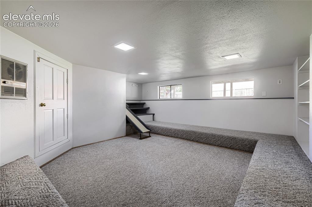 Image 13 of 30: Bonus Room is Super play area or sanctuary. Access is through family room d