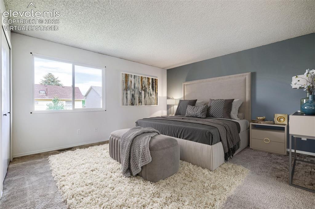 Image 15 of 30: virtually staged - Primary Bedroom - 14x14
