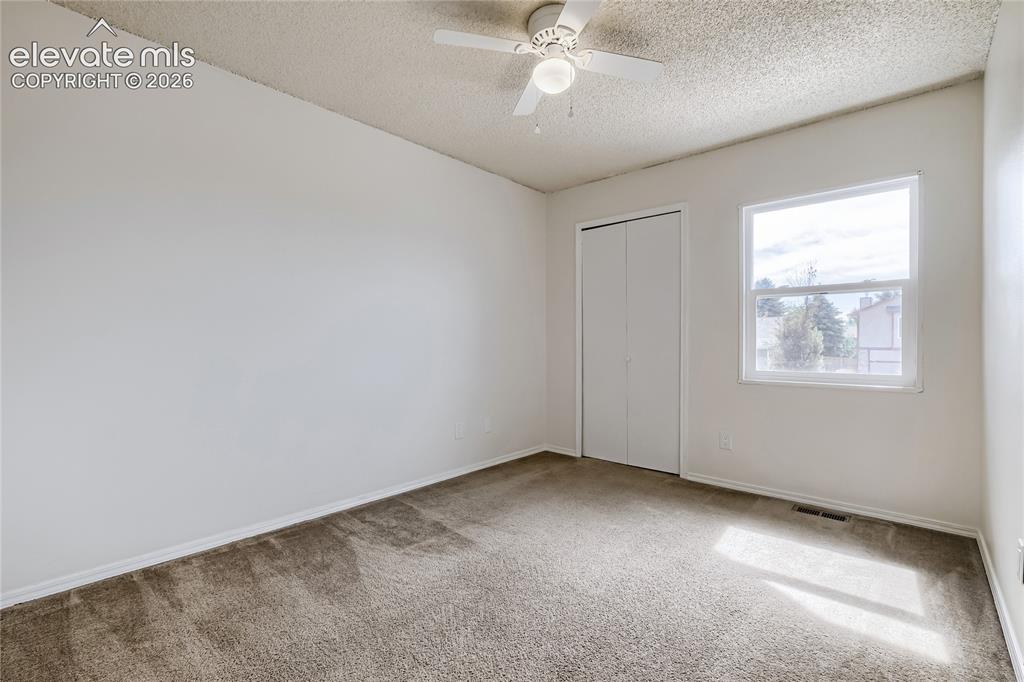 Image 20 of 30: Un-staged 2nd Bedroom-Upper Level - 10x10