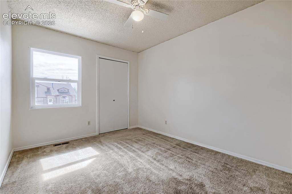 Image 23 of 30: Un-staged. 3rd Bedroom-Upper Level - 10x9
