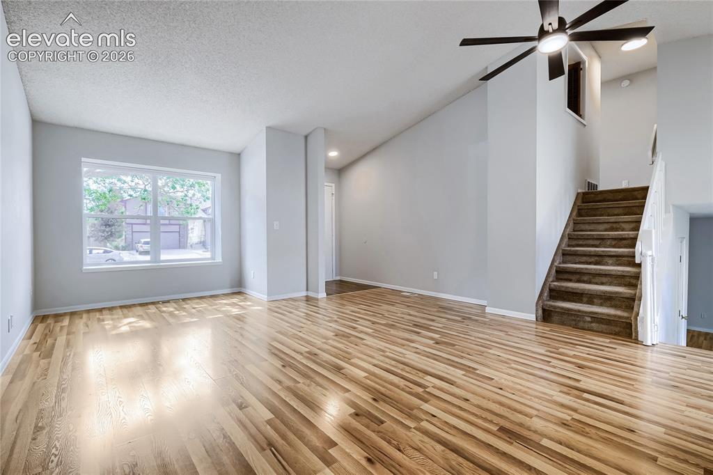 Image 4 of 30: Un-staged. Living room has beautiful flooring - 16x14