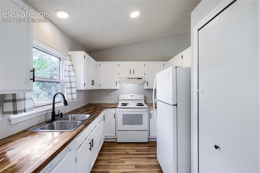 Image 8 of 30: Kitchen pantry is door on right