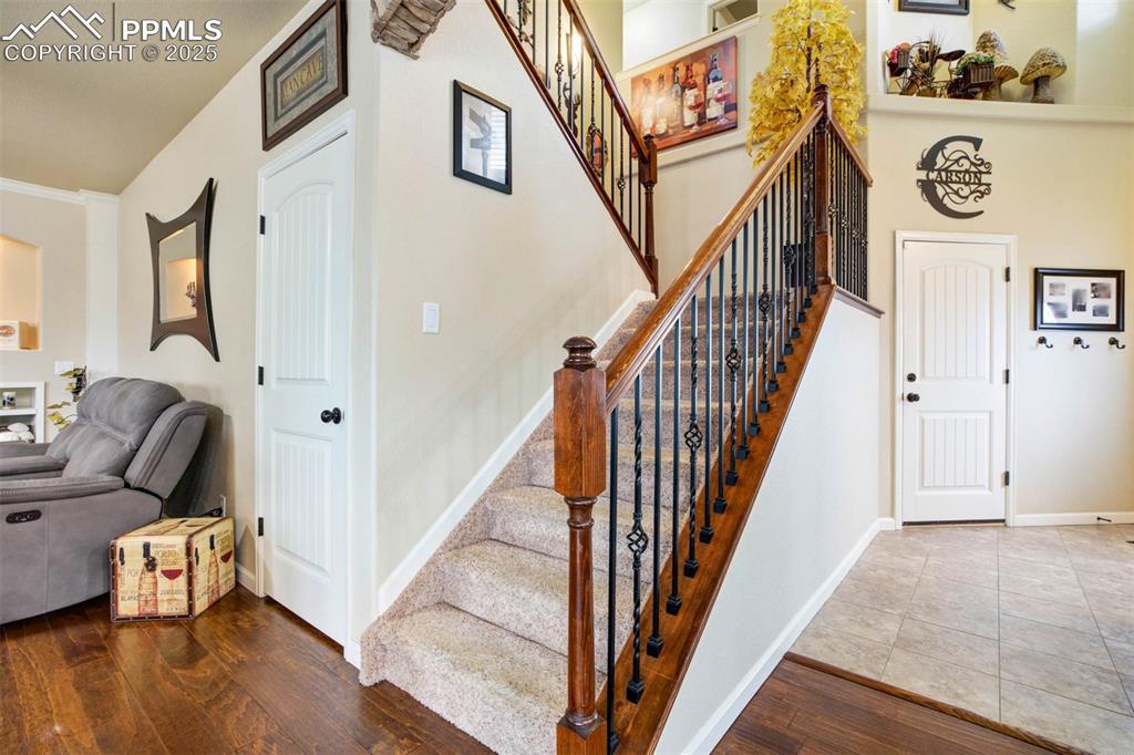 Image 19 of 49: Stairway featuring hardwood / wood-style flooring and baseboards