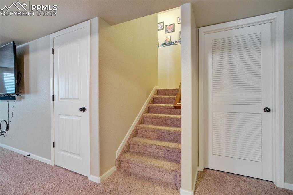 Image 36 of 49: Staircase featuring carpet flooring