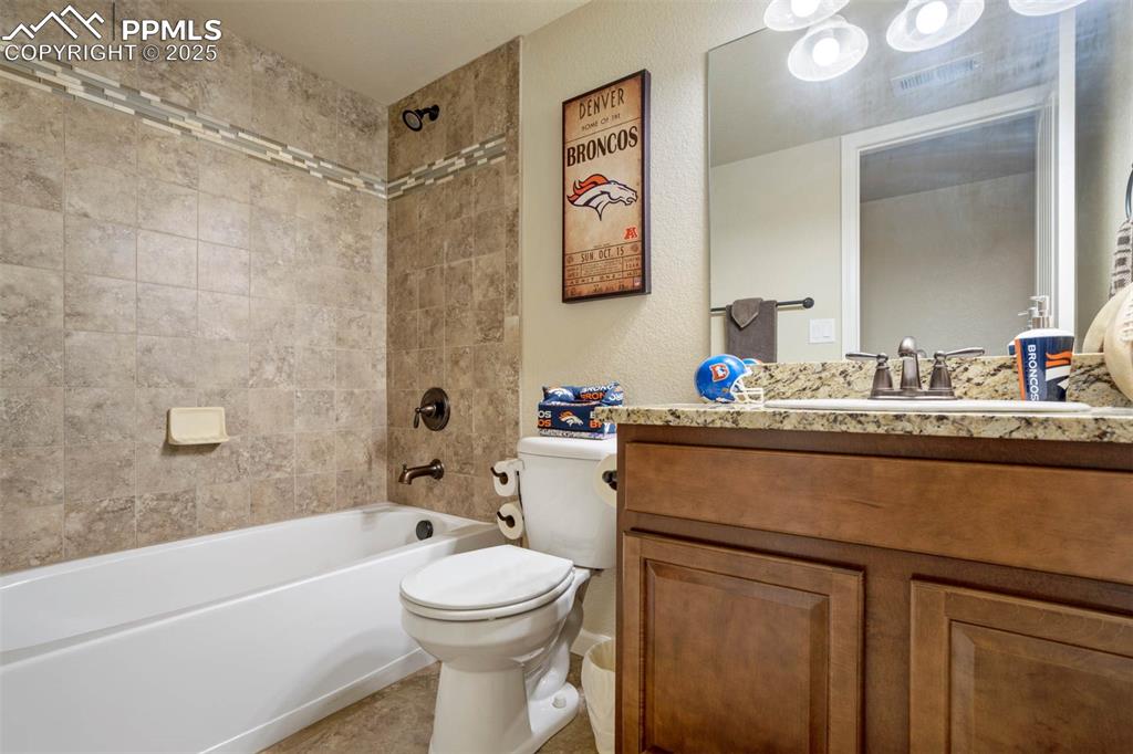 Image 42 of 49: Full bathroom with shower / bathtub combination and vanity