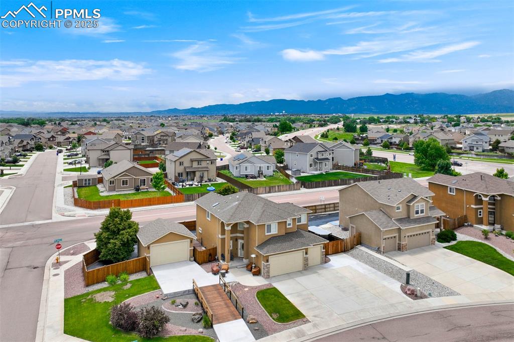 Image 49 of 49: Aerial view of residential area with mountains